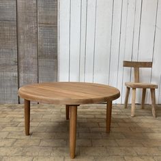 two wooden chairs sitting next to each other