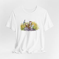 Wrap yourself in the warmth of nostalgia with my Calvin & Hobbes Hug Explorers T-shirt! This tee is a homage to the world of Calvin & Hobbes- a must-have for fans, and a perfect birthday or Christmas gift for fans of this classic comic strip! Message me if you want to buy this on a different color, product, T-Shirt, or Hoody!  Check out my RetroStarWears store to see my whole Calvin and Hobbes collection!  SHIPPING DETAILS: Processing time ranges from 1-7 days, typically quick, but during peak demand, it may extend up to 7 days. Overall, delivery time is usually between 4-10 days. Rest assured, you'll receive Delivery Tracking information, ensuring you're always in the loop. For any questions, I'm here basically 24/7-- your satisfaction is my priority!  RETURNS If the received item doesn't Vintage Crew Neck T-shirt With Cartoon Print, Vintage White T-shirt With Character Print, 90s Short Sleeve T-shirt With Character Print, 90s Character Print Short Sleeve T-shirt, 90s Style Character Print T-shirt, Vintage White T-shirt With Cartoon Print, White Vintage T-shirt With Cartoon Print, White 90s T-shirt With Character Print, Relaxed Fit Graphic Tee With Cartoon Print