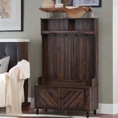 a wooden cabinet sitting in the corner of a room