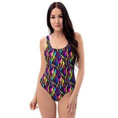 This one-piece swimsuit for all figures will bring out your best features. Enjoy the smooth fabric and the flattering design, and show it off by the sea or pool! * 82% Polyester, 18% Spandex * Fabric weight: 6.78 oz/yd² (230 g/m weight may vary by 5% * Chlorine-resistant fabric * Cheeky fit with a scoop neckline and a low scoop back * Zig-zag stitching * Double-layer front  * Four-way stretch material stretches and recovers on the cross and lengthwise grains Designed in the USA by JBLgrafix Multicolor One-piece Bodysuit For The Beach, Printed V-neck Bodysuit For Pool, Printed V-neck Bodysuit For The Pool, One-piece Swimwear With Vibrant Print For Beach, Bathing Suit Styles, Swimsuit Beach, Printed V-neck Beachwear One Piece, Bathing Suits One Piece, Beach Swimsuit