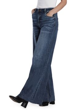 Raw hems refresh the retro style of elongating wide-leg jeans crafted from faded low-stretch denim. 32" inseam; 23" leg opening; 10 1/4" front rise Zip fly with button closure Five-pocket style 67% cotton, 27% REPREVE® recycled polyester, 5% rayon, 1% spandex REPREVE recycled polyester is made from 100% post-consumer recycled plastic bottles Machine wash, tumble dry Imported Dark Wash Denim Flare Jeans With Frayed Hem, Medium Wash Denim Flare Jeans With Frayed Hem, Denim Flare Jeans With Frayed Hem In Medium Wash, Washed Denim Blue Cropped Flare Jeans, Dark Wash Full Length Denim Flare Jeans, Denim Blue Washed Cropped Flare Jeans, Faded Wide Leg Washed Flare Jeans, Washed Blue Wide Leg Denim Flare Jeans, Dark Wash Cropped Flare Jeans