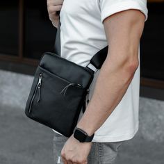 This leather men's bag is an exclusive accessory for true business style enthusiasts. It has a classic messenger design, which makes it the perfect choice for professional meetings and work duties. The quality of this bag is top-notch, it is made of high quality leather, which ensures its long service life. The capacity of the bag will allow you to conveniently organize your documents, tablet, phone and other necessary things. This bag is the perfect choice for men who appreciate quality and sty Handmade Leather Shoulder Bag, Cellphone Bag, Mens Bag, Business Style, Tablet Phone, Mens Leather Bag, Leather Gifts, Leather Messenger Bag, Leather Messenger