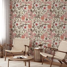 two chairs and a table in front of a wallpapered room with flowers on it