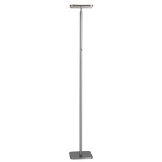 a floor lamp with a metal base and a white light on the top of it