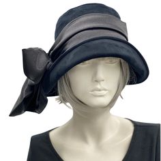 The Eleanor cloche is the quintessence of the 1920s and '30s. Think of Downton Abbey, Peaky Blinders, and Boardwalk Empire with the modern-day chic of the 2020s!This lovely handmade hat has a shaped crown and a wide front brim that can be worn tipped up in varying degrees to change the look. This style sits low down on the head and is sure to keep out the chill in the air, helping you stay warm and super stylish too.This Eleanor is handmade in a luxurious black velvet. Trimmed with a satin scarf Evening Gatsby Hat With Short Brim, Gatsby Style Cloche Hat For Kentucky Derby, Elegant Adjustable Cloche Hat For Vintage Events, Fitted Flapper Hat For Vintage Events, Elegant Fitted Lined Hats, Flapper Style Short Brim Cloche Hat For Kentucky Derby, Flapper Style Cloche Hat For Kentucky Derby, Elegant Wide Brim Hat For Vintage Fashion, Kentucky Derby Flapper Cloche Hat