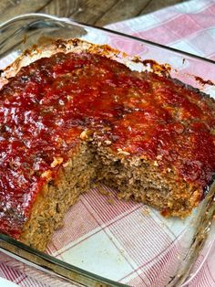 a meatloaf cake in a glass dish on a table