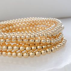 "High quality, beaded stretch bracelet is the perfect, minimalist design to create a stylish stack. Mix and match with your other favorites, the more the merrier! NOTE: This listing is for ONE bracelet * T H E * D E T A I L S * * Choose from Sterling silver or 14k Gold fill * 3mm or 4mm beads * Stretch Bracelet has no clasp * Thoughtfully packaged & ready for gift giving! * Handmade, just for you, in our sunny California Studio * Our 365 Guarantee: Our jewelry is guaranteed for 1 year after Stacked Beaded Bracelets, Diamond Nose Stud, The More The Merrier, Ball Bracelet, Tiny Studs, Tiny Stud Earrings, Small Earrings Studs, Stackable Bracelets, Bead Bracelets