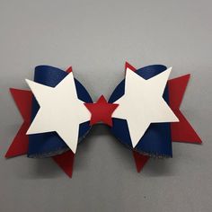 two red, white and blue bows with stars on them