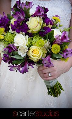 a bride holding a bouquet of flowers in her hands