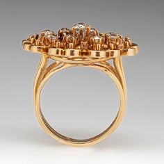 This beautiful diamond ring features a gallery with an openwork design and is centered with one (1) old European cut diamond set into a six-prong setting. The center stone is bordered with eight (8) old European cut diamonds set into six- prong settings. The ring measures 24.5mm at the top, rises 8.2mm above the finger, tapering to 4.1mm wide and 1.3mm thick at the base of the shank. The ring is currently a size 6 and has a great patina. Victorian Style Formal Cluster Ring With Single Cut Diamonds, Vintage Diamond Ring With Bezel Setting For Formal Events, Antique Diamond Ring With Halo Setting For Formal Occasions, Antique Diamond Ring With Halo Setting For Formal Events, Victorian Cluster Ring With Halo Setting For Formal Occasions, Victorian Style Halo Setting Cluster Ring For Formal Occasions, Formal Diamond Cluster Ring With Bezel Setting, Vintage Diamond Rings With Bezel Setting, Antique Diamond Ring With Prong Setting