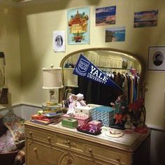 a dresser with many items on it in front of a mirror