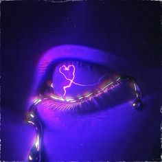 a purple light with a heart drawn on it's side in the middle of its image