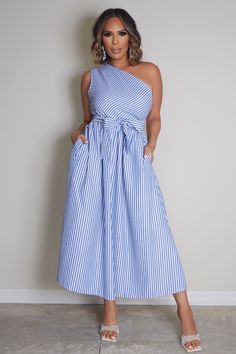 Stay effortlessly stylish with the Shelby Striped Chic Dress. This blue striped A-line dress features an asymmetrical neckline, a high waist with a belted design, and convenient side pockets. The sleeveless, midi-length silhouette offers a relaxed, regular fit, while the flared hem adds a touch of elegance. Made from non-stretch fabric, this casual dress is perfect for laid-back days with a touch of flair. 100% Polyester Model is wearing size Small. Please allow 3-5 business days to process and ship. in cm : US Size Bust Waist Size Length 4 S 93 72 124 6 M 97 76 126 8/10 L 103 82 128 12 XL 109 88 130 Striped Belted Dress For Spring, Spring Striped Belted Dress, Elegant Striped Belted Dress, Chic Striped Belted Dress, Spring One-shoulder Dress With Tie Waist, One Shoulder Summer Dress With Tie Waist, One-shoulder Tie-waist Summer Dress, Striped Belted Dress For Summer, Striped Belted Summer Dress