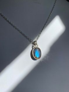 -Handmade from fine silver bezel wire, sterling silver and labradorite - Your choice of 18 or 20 inch solid sterling silver chain - 20mm tall and 12mm wide ~Metaphysical Properties~ -regulates metabolism -stimulates intuition -useful companion through times of change -banishes fears and insecurities -strengthens faith and trust in yourself and the universe Silver Round Labradorite Necklaces, Silver Labradorite Necklaces, Silver Labradorite Round Pendant Necklace, Silver Labradorite Round Necklace, Silver Labradorite Necklace For Healing, Silver Labradorite Dainty Jewelry, Dainty Silver Labradorite Jewelry, Silver Oval Labradorite Necklace, Silver Labradorite Oval Necklace