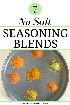 seven different types of seasoning on a plate with text overlay that reads 7 no salt seasoning blends