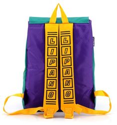 a purple and blue backpack with yellow straps on the front, sitting against a white background