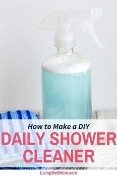 a bottle of diy shower cleaner sitting on top of a table next to a blue towel