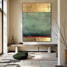 a large painting hanging on the wall in a living room