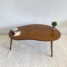 a wooden coffee table with a book on top