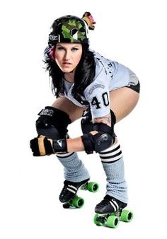 a woman wearing roller skates and knee pads posing for the camera with her hands on her knees