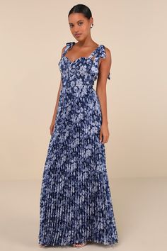 Everyone knows that you're a style icon, but the Lulus Illustrious Aura Navy Blue Floral Bustier Tie-Strap Maxi Dress will have them in awe all over again! A timeless floral print adorns lightly crinkled, airy woven fabric as it shapes a bustier-inspired bodice with a sweetheart neckline and seamed cups and detailing, supported by long straps that tie at the shoulders. The high, fitted waist top a flowy, pleated A-line skirt that falls to as sweeping maxi hem. Hidden back zipper/clasp. Fit: This Blue Fitted Maxi Dress With Ruffled Straps, Blue Formal Dress With Adjustable Straps, Blue Dress With Adjustable Straps And Fitted Bodice, Blue Maxi Dress With Ruffled Straps For Party, Blue Party Dresses With Adjustable Straps, Blue Dress With Straps And Sweetheart Neckline, Blue Dresses With Sweetheart Neckline And Straps, Blue Sweetheart Neckline Dress With Straps, Summer Evening Dress With Removable Straps