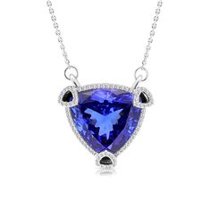 Sophisticated and romantic, this triangle cut violet tanzanite pendant will take her breath away. Crafted in 18K white gold, this one of a kind necklace features an outstanding tanzanite wrapped in a triangle shaped subtle embellished diamond halo, placed in a unique setting of three open pave-lined diamond triangle prongs holding the striking center stone for extra sparkle and detail. This radiant look is one she'll turn to often, everyday, and on special occasions. An White Gold Tanzanite Necklace For Formal Occasions, Formal Tanzanite Necklace Fine Jewelry, Formal Tanzanite Fine Jewelry Necklace, Tanzanite Gemstone Necklace In Fine Jewelry Style, Formal White Gold Tanzanite Necklace, Formal Tanzanite Diamond Cut Necklace, Formal Sapphire Tanzanite Necklace, Formal Silver Tanzanite Necklaces, Fine Jewelry Tanzanite Gemstone Necklaces