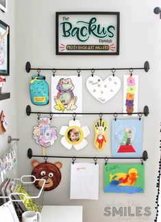 a wall with pictures and magnets on it in a child's playroom