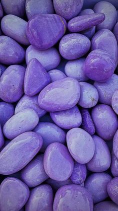 a pile of purple rocks sitting next to each other