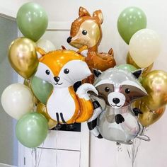 a bunch of balloons that are in the shape of animals and raccoons