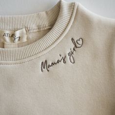 Introducing our adorable baby crewneck sweatshirt, designed to keep your little one cozy and stylish. Crafted with utmost care, it features an embroidered "mama's boy" or "mama's girl" design along the collar line. Made from a premium fabric blend, this sweatshirt is soft, breathable, and perfect for both warm and cool weather. Its neutral tone complements any outfit, making it a versatile choice for various occasions. Dress your little one in this comfy sweatshirt and watch them radiate cutenes Sock Booties, Comfy Sweatshirt, Outfit Making, Resort Collection, One Piece Swim, Knit Sweatshirt, Adorable Baby, Sweatshirt Dress