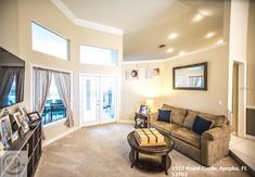 a living room filled with furniture and a flat screen tv