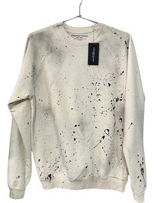 SPLAT Your new fave sweatshirt! One of a kind Color: vintage ivory with splattered and sprayed paint 100% Organic cotton | Pre-washed | Super soft | Dyed for the perfect vintage colorDetailed with distressed double raw edge seams and contrast seam stitching for a unique vintage look. Each garment is cut, sewn, dyed and printed in the USA Sizing - Unsweetened New York fits true to size. Want a roomier boyfriend look, go a size up. Want to show off the girls, go a size down. White Distressed Sweatshirt, White Distressed Long Sleeve Sweatshirt, White Distressed Casual Sweatshirt, Urban Distressed Acid Wash Sweatshirt, Bleached Crew Neck Sweatshirt For Streetwear, Bleached Cotton Sweatshirt For Streetwear, Cotton Bleached Sweatshirt For Streetwear, Distressed Acid Wash Long Sleeve Sweatshirt, Oversized Bleached Cotton Sweatshirt