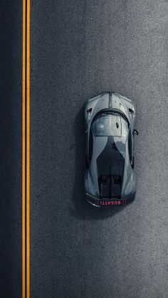 an overhead view of a sports car on the road