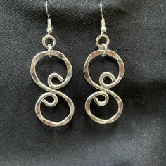 These Silver Tone Swirl Earrings Are Beautiful Hammered And Extremely Durable. They Hang Approx. 2’ From The Fish Hook Base. As With Many Of My Listings, These Are New Never Worn, And Some Of My Silver Tone Earrings Listed Also Have Matching Necklaces Listed As Well. Thank You For Your Interest. Nickel Free Silver Swirl Earrings, Silver Swirl Wire Wrapped Earrings, Adjustable Metal Swirl Jewelry, Handmade Silver Swirl Earrings, Swirl-shaped Earrings With Ear Wire, Silver Swirl Earrings, Metal Swirl Earrings With Ear Wire, Silver Swirl Pierced Earrings, Silver Spiral Metal Earrings