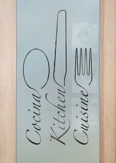 a glass door with the words kitchen written on it and utensils in cursive writing