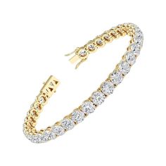 This exquisite tennis bracelet is a true statement piece, featuring a total of 36 dazzling Natural Round Brilliant Cut Diamonds set in a rich 14K Yellow Gold setting. Here are the captivating details: Total Carat Weight: 10.69 carats, showcasing an array of brilliant diamonds that create an alluring sparkle. Color: The diamonds exhibit a range of F - H colors, offering a spectrum of white and near-colorless shades that enhance the bracelet's elegance. Clarity: With VS1-SI1 clarity, these diamonds are not only beautiful but also 100% eye-clean, ensuring their brilliance remains uninterrupted. Setting: The diamonds are meticulously set in a luxurious 14K Yellow Gold setting, adding a touch of warmth and richness to the bracelet. Design: This tennis bracelet features a classic design with rou Fine Jewelry Yellow Gold Tennis Bracelet, Luxury 14k Yellow Gold Tennis Bracelet, Exquisite Luxury Yellow Gold Tennis Bracelet, Luxury Hallmarked Yellow Gold Tennis Bracelet, Luxury Yellow Gold Tennis Bracelet, Fine Jewelry, Yellow Gold Setting, Fine Jewels, Brilliant Diamond, Tennis Bracelet