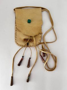 SACRED WARRIOR MAGICAL MEDICINE BAG ,  THIS BAG IS SOFT BUCKSKIN LEATHER . WITH LEATHER STRINGS . THIS UNIQUE BAG MEASURES  3 x 4 .5 "  MEDICINE POUCHES , BAGS HAVE ALWAYS BEEN A PART OF THE NATIVE AMERICANS. THEY WERE WORN AROUND THEIR NECKS , OR HUNG IN A SPIRITUAL PLACE. THEY WERE FILLED WITH THE UNIQUE, POWERFUL MAGICAL ITEMS OF THAT PERSON . I HAVE ONE HANGING IN MY CAR FOR SAFE TRAVELS.  MY MEDICINE BAGS HAVE A WAY OF FINDING THE PEOPLE THAT NEED THEM .  THIS SPIRITUAL BAG IS READY TO FIND ITS WAY TO YOUR HEART AND YOUR HOME .  WITH ALL SINCERITY , JOY , PROSPERITY , ABUNDANCE IN ALL THINGS , LOVE AND HAPPINESS, WITH EVERY FOOTSTEP, AND BREATH YOU TAKE , OR THE ONE YOU CHOSE TO GIVE THIS MEDICINE BAG TO   THIS ONE COMES FROM MY LOVING HANDS , SOUL AND HEART TO YOURS .  PLEASE LOOK CL Handmade Adjustable Rectangular Shoulder Bag, Handmade Spiritual Bag For Festivals, Unique Natural Bag For Everyday Use, Artisan Natural Color Bag For Gift, Artisan Natural Color Bags For Gifts, Leather Bag With Cell Phone Pocket And Adjustable Strap, Bohemian Brown Bag For Personal Use, Brown Bohemian Bag For Personal Use, Artisan Natural Pouch Shoulder Bag