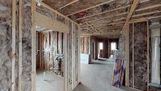 the interior of a house being built with wooden framing and walls in place for insulation