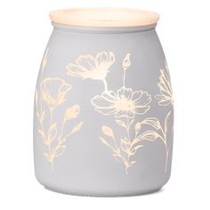 a gray vase with white flowers painted on it