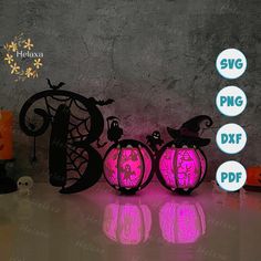 three halloween pumpkins are lit up with pink light and the words svg png dxf