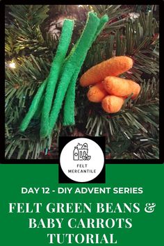 two carrots are hanging from a christmas tree with the words felt green beans and baby carrots on it