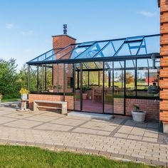 a brick building with a glass roof and windows