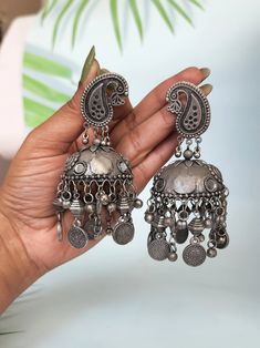 Add ethnicity and charm to your beautiful personality with these uniquely designed black metal earrings. The intricate work gives combo set a very appealing and eye catching look.Pair them up with any semi formal or casual attire and win compliments for your unique choice! Materials: German Silver, oxidised silver, Alpaca silver, white metal Style: Boho & hippie Cheap Oxidized Round Earrings, Cheap Oxidized Metal Earrings, Oxidized Silver Earrings Jhumka Hoop, Luxury Festive Earrings With Oxidized Finish, Cheap Bohemian Metal Jhumkas, Luxury Oxidized Finish Dangle Earrings, Bohemian Heavy Metal Jhumkas, Diwali Oxidized Metal Jhumkas, Festive Ceremonial Oxidized Finish Earrings