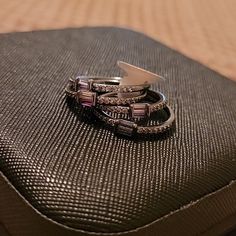 a stack of rings sitting on top of a piece of luggage