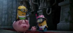 two minion characters standing next to each other in front of a piggy bank