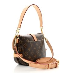 This is an authentic LOUIS VUITTON Monogram Saumur BB. This bag is crafted of monogram coated canvas. It features a vachetta leather buckles and trim, a removable vachetta handle, an optional shoulder strap, and polished brass hardware. The magnetic closure opens to a beige microfiber interior. Leather Buckle, Brass Hardware, Polished Brass, Authentic Louis Vuitton, Magnetic Closure, Louis Vuitton Monogram, Shoulder Strap, Louis Vuitton, Monogram