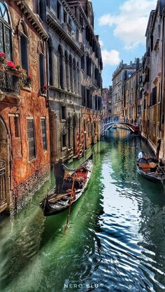 two gondola boats on a canal in venice, italy