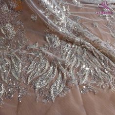 Price: The price is for 1 yard. if you buy more than 1 yard ,it won't be cut. will come in one piece the longest is 20 yards. Material: polyester,sequins,beads Fixed Wide : 125cm or 49 inches. color:off white Want to see other colors and more similar Beading lace fabrics come to: https://www.etsy.com/shop/Randyfabrics?ref=hdr_shop_menu&section_id=14192305 Shipping: Choose the shipping way you need, if you want package shipped by express,please note the phone number on order. Use for Dress,cl Silver Sequin Lace Fabric For Wedding, Silver Lace Sequin Fabric In Glamorous Style, Silver Embellished Lace Tulle Fabric, Embellished Silver Lace Tulle Fabric, Silver Glamorous Lace Sequin Fabric, Silver Sequined Lace For Wedding, Silver Lace Tulle Fabric For Wedding, Glamorous Silver Sequin Lace Fabric, Silver Lace Sequin Fabric With Rhinestones