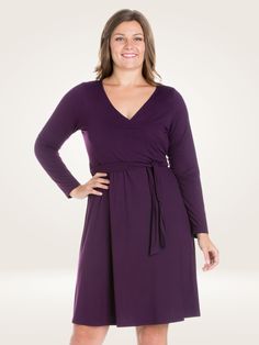 material:92% poly, 8% spandexThis long-sleeve plus size dress hits just above the knee and features a classic wrap-style closure and construction, a V-neck, and a tie closure along the waist to enhance a feminine silhouette. Perfect for a wedding guest or a night out. Solid V-neck Workwear Dress For Fall, Fall Workwear V-neck Dress, Solid Color V-neck Wrap Dress For Fall, Solid Long Sleeve Wrap Dress For Spring, Spring Long Sleeve Solid Wrap Dress, Long Sleeve Tie Waist Wrap Dress For Work, Long Sleeve Wrap Dress With Tie Waist For Work, V-neck Long Sleeve Dress For Fall, Chic Solid Color Long Sleeve Wrap Dress