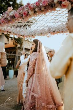 a bride and groom walking down the aisle